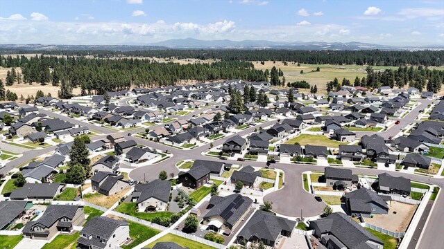 8812 W Pirates Ct, Spokane, WA 99224 - aerial view of property and surrounding area featuring a mountain backdrop and nearby suburban area