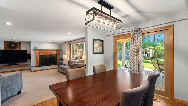 811 W Teal Ave, Spokane, WA 99218 - dining area featuring a fireplace with raised hearth, a chandelier, and recessed lighting