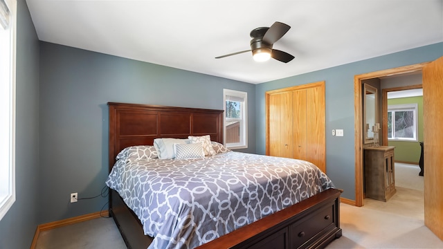811 W Teal Ave, Spokane, WA 99218 - bedroom with light colored carpet, a closet, and a ceiling fan