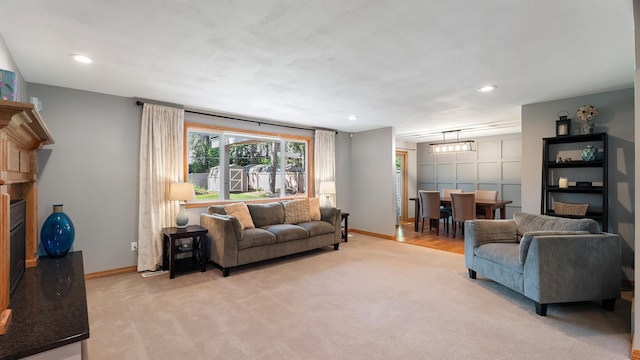 811 W Teal Ave, Spokane, WA 99218 - living area with light carpet, recessed lighting, and a fireplace with raised hearth
