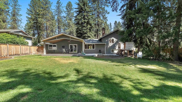 811 W Teal Ave, Spokane, WA 99218 - rear view of house featuring a chimney and a deck
