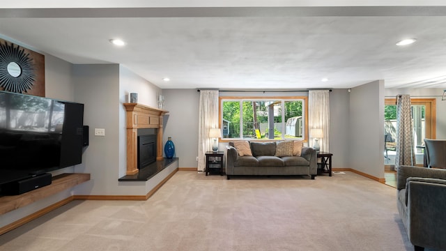 811 W Teal Ave, Spokane, WA 99218 - living room featuring light colored carpet, recessed lighting, and a glass covered fireplace