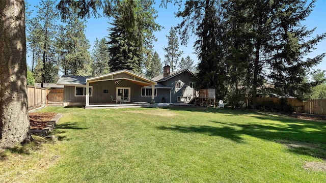 811 W Teal Ave, Spokane, WA 99218 - back of house with a fenced backyard