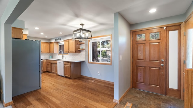 811 W Teal Ave, Spokane, WA 99218 - kitchen with freestanding refrigerator, light countertops, dishwasher, decorative backsplash, and open shelves