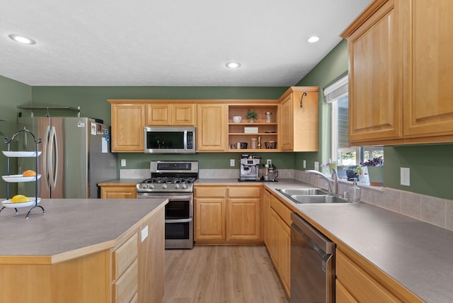 3421 S Mcdonald St, Spokane Valley, WA 99206 - kitchen featuring stainless steel appliances, light wood-style flooring, light brown cabinetry, open shelves, and recessed lighting