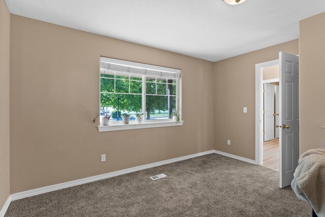 3421 S Mcdonald St, Spokane Valley, WA 99206 - carpeted empty room featuring baseboards