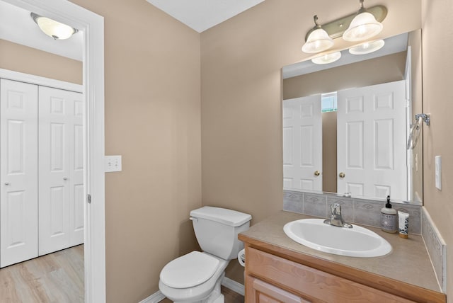 3421 S Mcdonald St, Spokane Valley, WA 99206 - half bath featuring vanity and wood finished floors