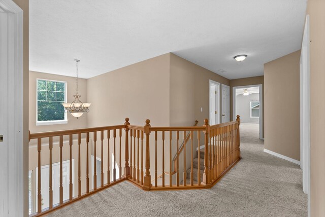 3421 S Mcdonald St, Spokane Valley, WA 99206 - hallway featuring an upstairs landing, carpet floors, and a chandelier