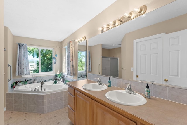 3421 S Mcdonald St, Spokane Valley, WA 99206 - full bathroom with plenty of natural light, a bath, double vanity, and tile patterned flooring