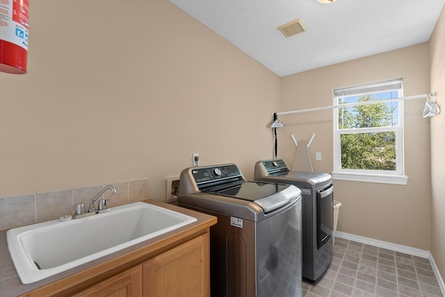 3421 S Mcdonald St, Spokane Valley, WA 99206 - washroom featuring cabinet space, washing machine and clothes dryer, and light flooring