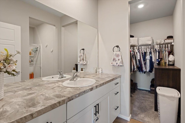 8403 W Red Ave, Cheney, WA 99004 - bathroom featuring vanity and a walk in closet