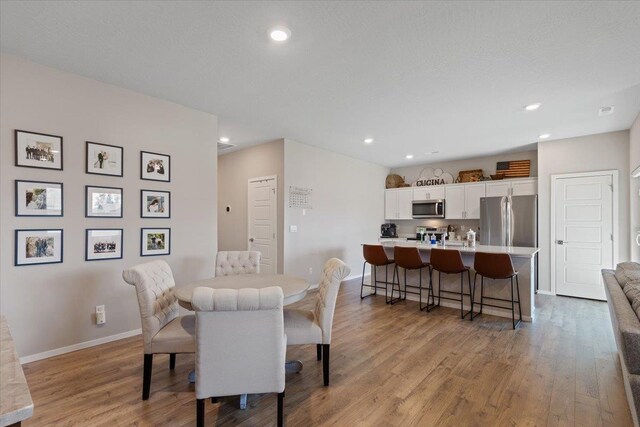8403 W Red Ave, Cheney, WA 99004 - dining area featuring light wood-style floors and recessed lighting