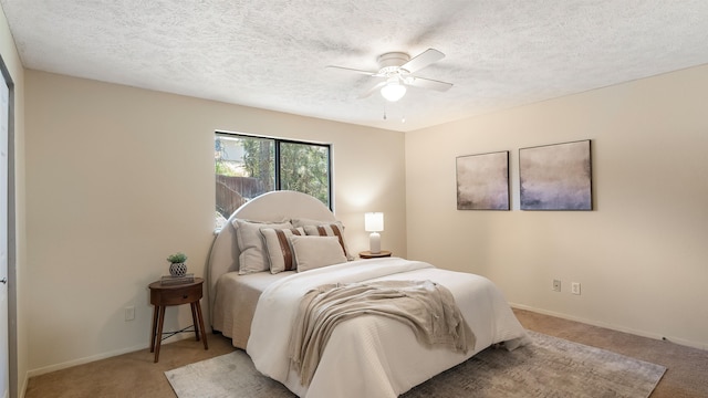 5623 W Lyons Ct, Spokane, WA 99208 - bedroom with light carpet, ceiling fan, and a textured ceiling
