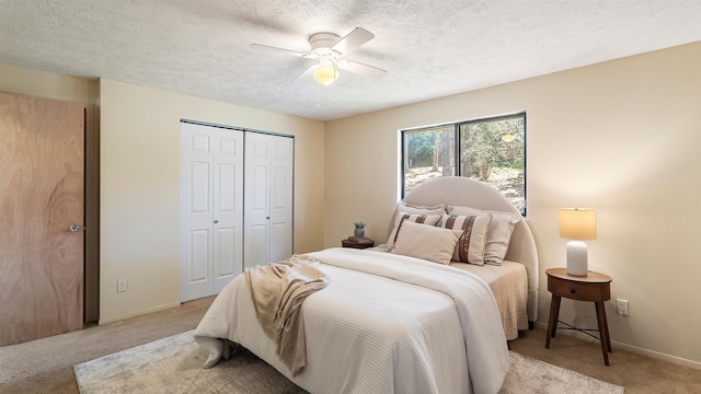 5623 W Lyons Ct, Spokane, WA 99208 - bedroom with light colored carpet, a closet, a ceiling fan, and a textured ceiling