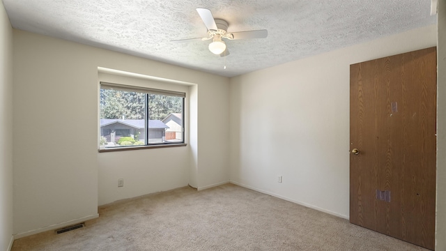 5623 W Lyons Ct, Spokane, WA 99208 - unfurnished room featuring a ceiling fan, carpet floors, and a textured ceiling