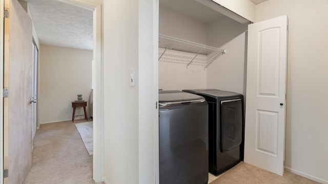 5623 W Lyons Ct, Spokane, WA 99208 - laundry area with light carpet and separate washer and dryer