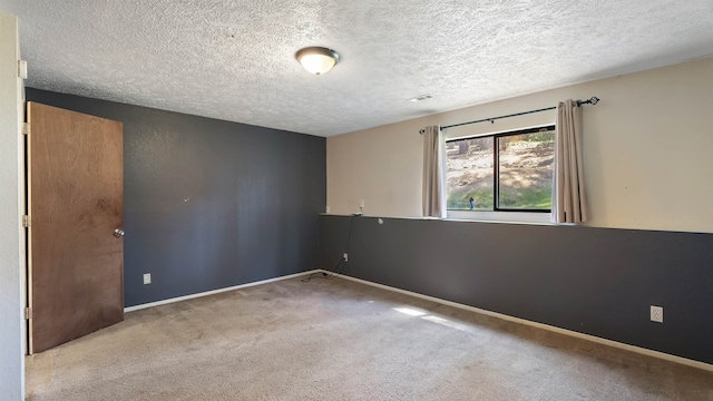5623 W Lyons Ct, Spokane, WA 99208 - carpeted empty room featuring a textured ceiling