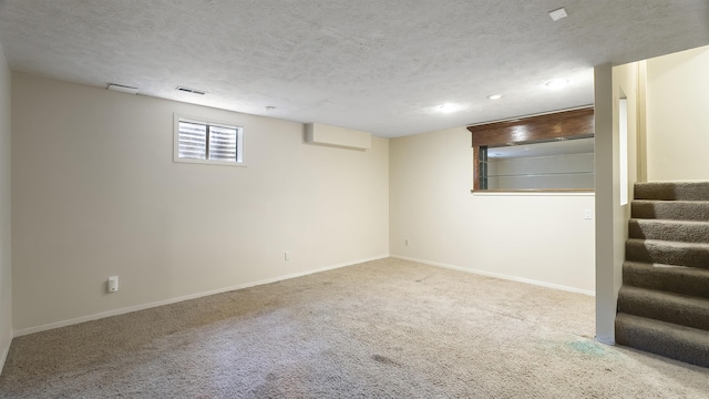 5623 W Lyons Ct, Spokane, WA 99208 - below grade area with stairway, carpet floors, a textured ceiling, and recessed lighting