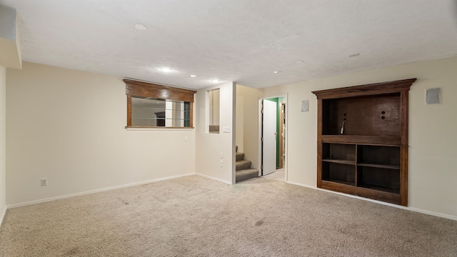 5623 W Lyons Ct, Spokane, WA 99208 - carpeted spare room with stairway and recessed lighting