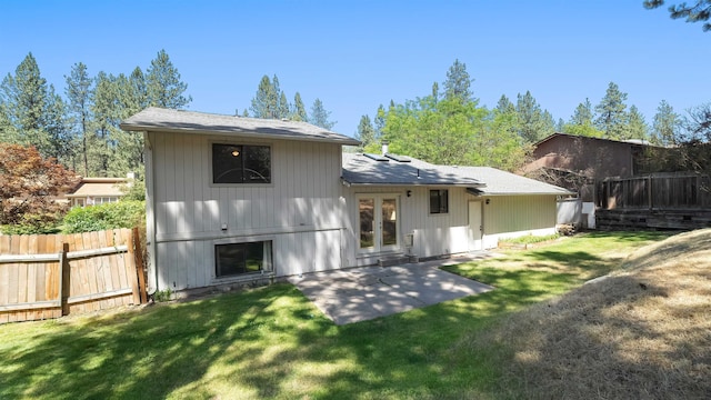 5623 W Lyons Ct, Spokane, WA 99208 - rear view of property featuring french doors, a patio, and a shingled roof