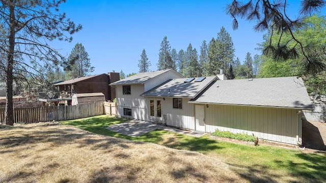 5623 W Lyons Ct, Spokane, WA 99208 - back of house with solar panels, a patio area, and a shingled roof