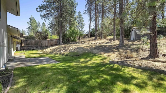 5623 W Lyons Ct, Spokane, WA 99208 - fenced backyard featuring a storage shed and a patio