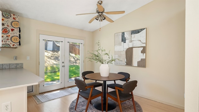 5623 W Lyons Ct, Spokane, WA 99208 - dining room with vaulted ceiling, light wood-style flooring, french doors, and ceiling fan