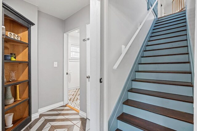 3129 E 34th Ave, Spokane, WA 99223 - staircase featuring tile patterned flooring and inlaid floor details