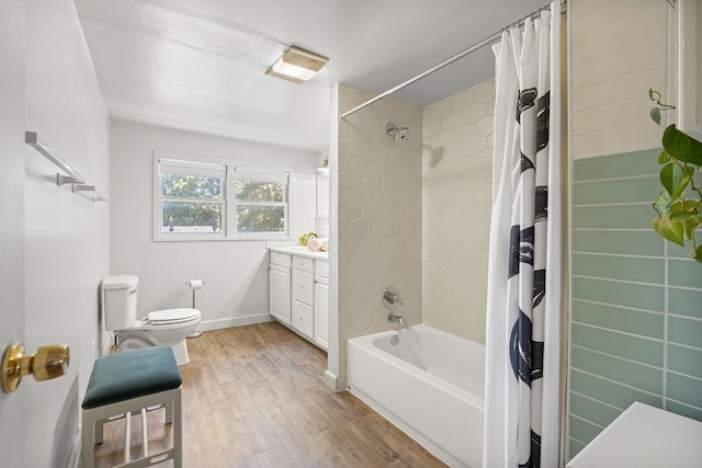 3129 E 34th Ave, Spokane, WA 99223 - full bathroom featuring wood finished floors, vanity, and shower / tub combo