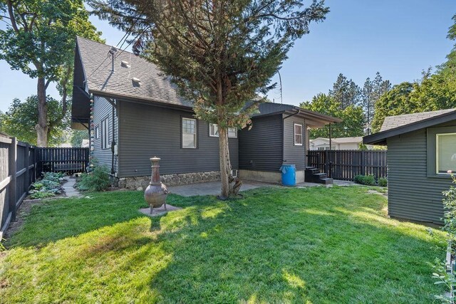 3129 E 34th Ave, Spokane, WA 99223 - back of house with a fenced backyard