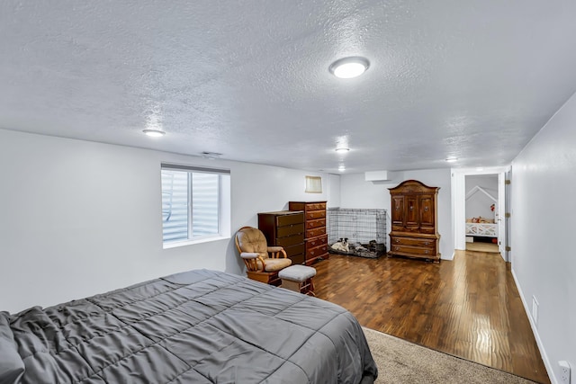 5917 N Addison St, Spokane, WA 99208 - bedroom with a textured ceiling and wood finished floors