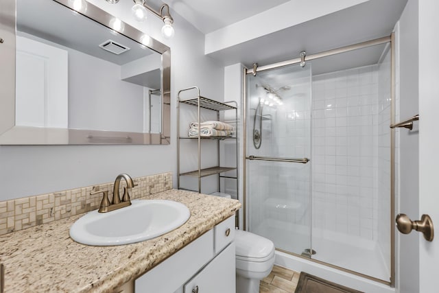 5917 N Addison St, Spokane, WA 99208 - full bathroom featuring a shower stall, vanity, and backsplash