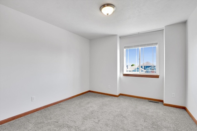 2312 W Abigail Ct, Spokane, WA 99208 - carpeted spare room with baseboards