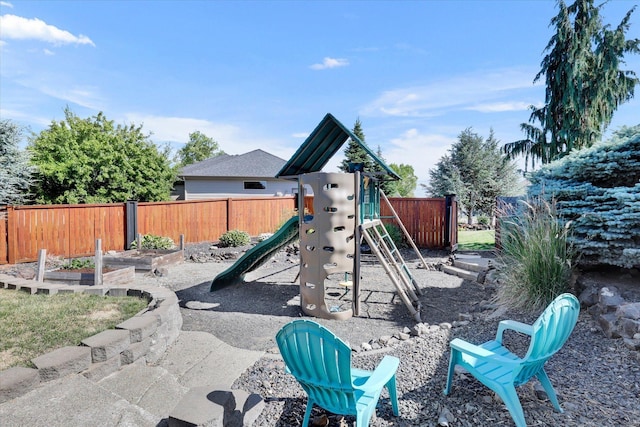 2312 W Abigail Ct, Spokane, WA 99208 - view of jungle gym with a vegetable garden