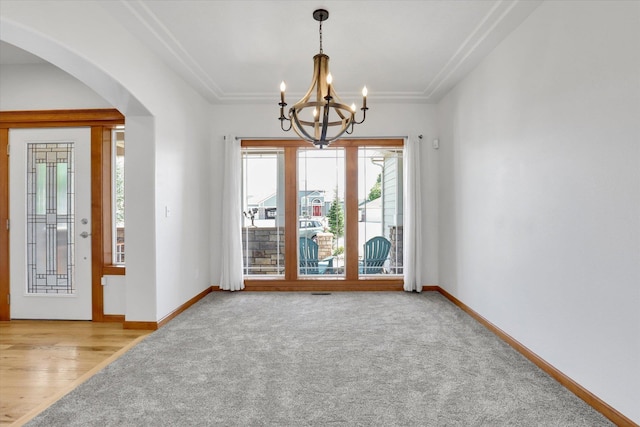 2312 W Abigail Ct, Spokane, WA 99208 - carpeted empty room with arched walkways and a chandelier