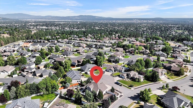2312 W Abigail Ct, Spokane, WA 99208 - aerial overview of property's location with mountains and nearby suburban area