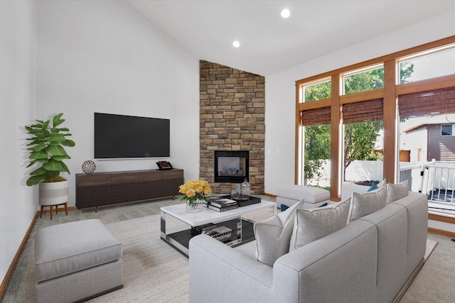 2312 W Abigail Ct, Spokane, WA 99208 - living area featuring a stone fireplace, high vaulted ceiling, and recessed lighting