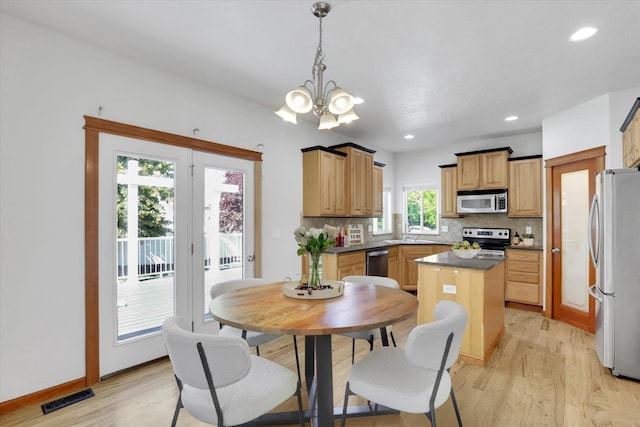 2312 W Abigail Ct, Spokane, WA 99208 - dining space with light wood-style flooring, a chandelier, and recessed lighting