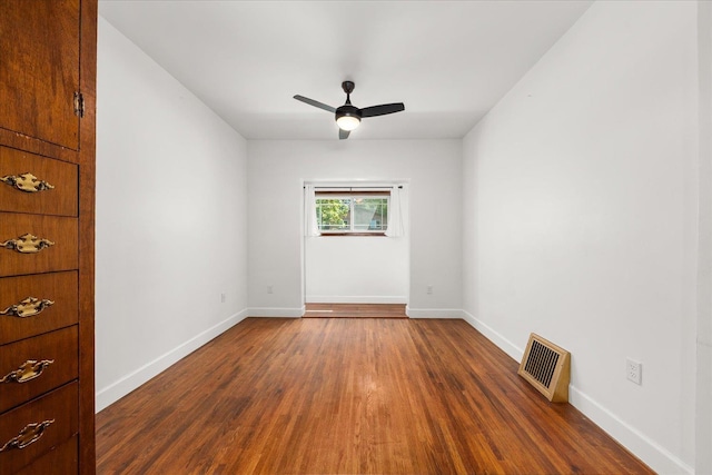 1728 S Adams St, Spokane, WA 99203 - spare room with dark wood finished floors and a ceiling fan