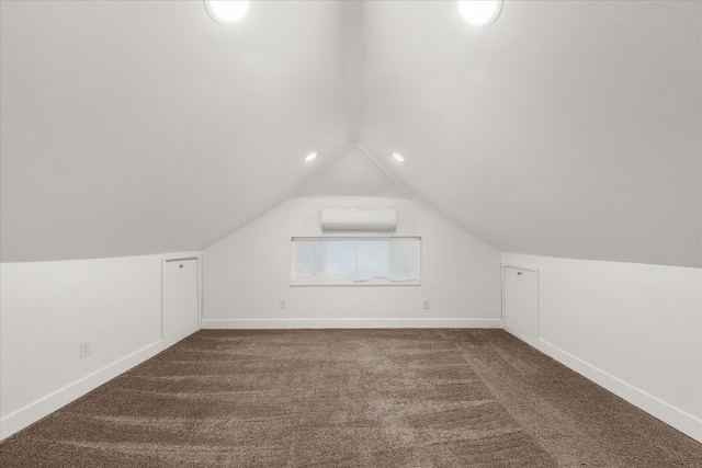 1728 S Adams St, Spokane, WA 99203 - bonus room featuring a wall unit AC, dark carpet, and lofted ceiling
