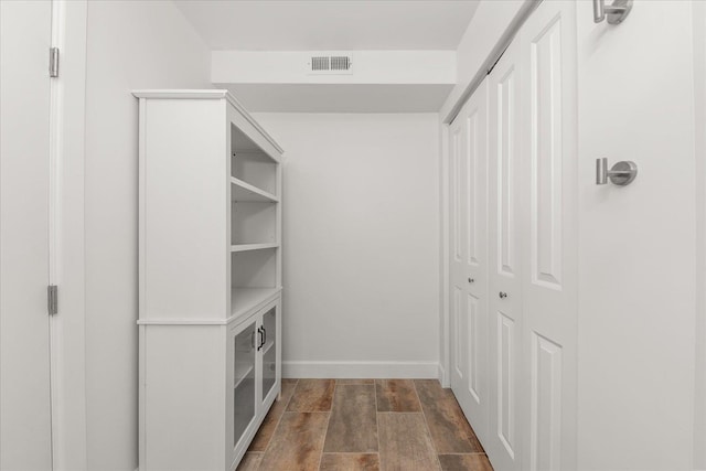 1728 S Adams St, Spokane, WA 99203 - spacious closet featuring dark wood-type flooring