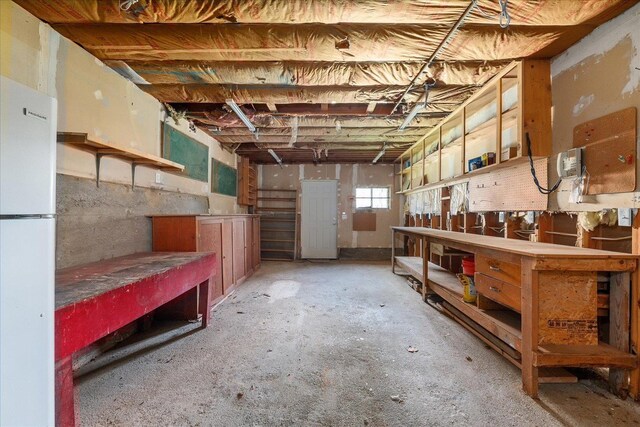 1728 S Adams St, Spokane, WA 99203 - basement featuring a workshop area and freestanding refrigerator