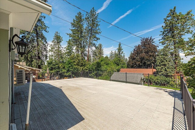 1728 S Adams St, Spokane, WA 99203 - view of patio / terrace with view of scattered trees and a deck