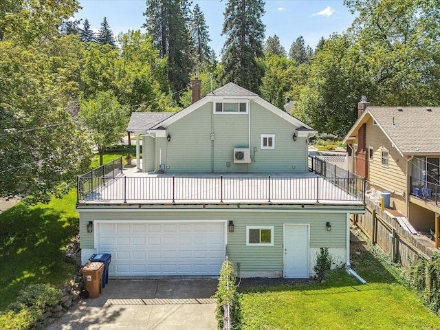1728 S Adams St, Spokane, WA 99203 - rear view of house featuring driveway, a lawn, and an attached garage