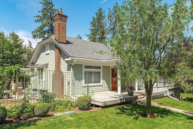1728 S Adams St, Spokane, WA 99203 - view of front of home featuring a shingled roof, a front lawn, and a chimney