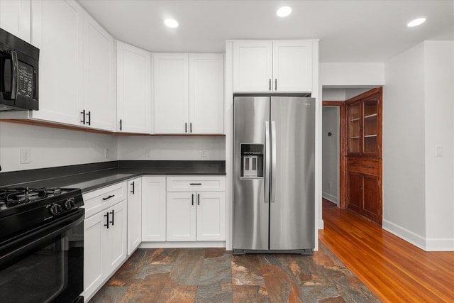 1728 S Adams St, Spokane, WA 99203 - kitchen with black appliances, dark countertops, white cabinetry, dark stone finish flooring, and recessed lighting