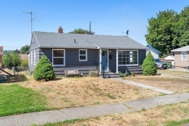 4615 N King Ct, Spokane, WA 99205 - view of front of home with a shingled roof and a chimney