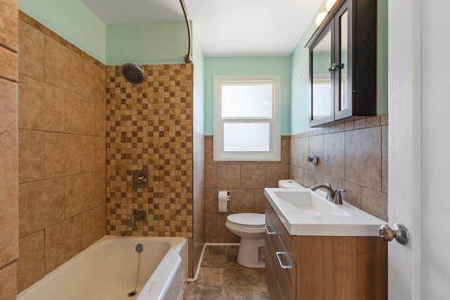4615 N King Ct, Spokane, WA 99205 - bathroom with vanity, washtub / shower combination, tile walls, and wainscoting