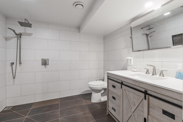 4615 N King Ct, Spokane, WA 99205 - full bath with tile walls, tiled shower, vanity, and tile patterned floors