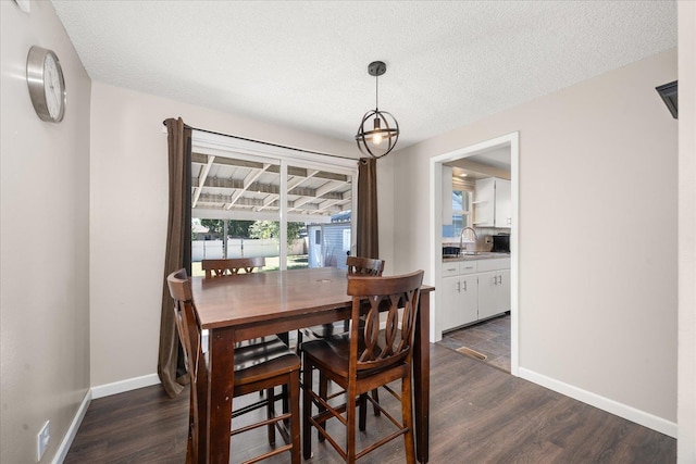 1634 E Dalke Ave, Spokane, WA 99208 - dining area with dark wood-style flooring and a textured ceiling
